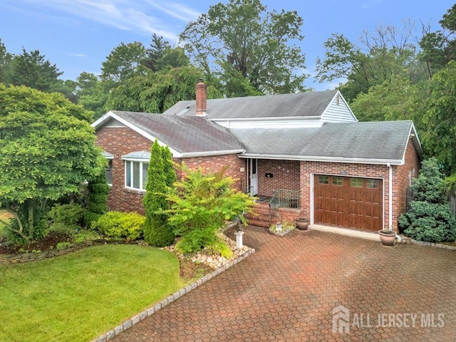 605 Beechwood Ave, Middlesex, NJ 08846 - view of front of home featuring a garage, brick siding, roof with shingles, a chimney, and a front yard