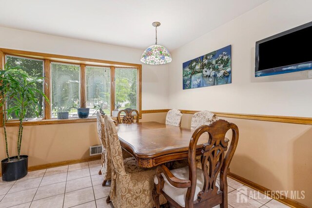 605 Beechwood Ave, Middlesex, NJ 08846 - dining room featuring light tile patterned floors and baseboards