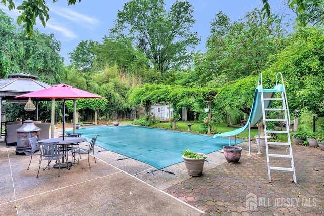605 Beechwood Ave, Middlesex, NJ 08846 - view of swimming pool with a water slide, a gazebo, a patio area, and view of scattered trees