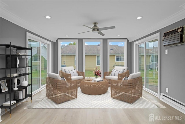 sunroom featuring plenty of natural light, ceiling fan, and a wall mounted AC