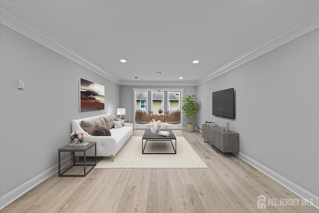 living room featuring ornamental molding and light hardwood / wood-style floors