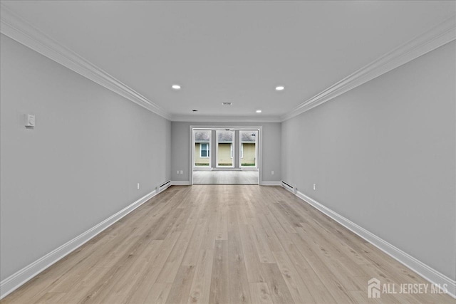 unfurnished room with light hardwood / wood-style flooring, crown molding, and a baseboard heating unit