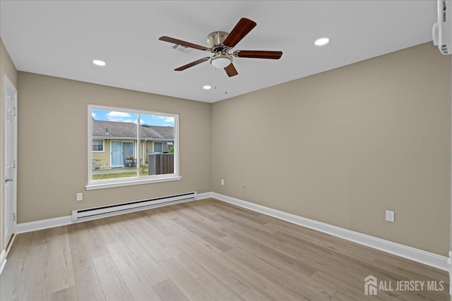 unfurnished room with a baseboard heating unit, ceiling fan, and light hardwood / wood-style floors