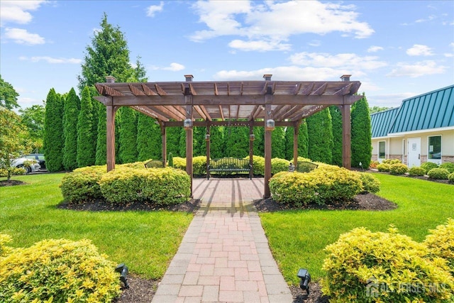 view of community featuring a yard and a pergola