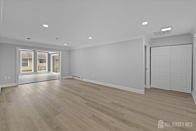 unfurnished living room featuring light hardwood / wood-style floors, crown molding, and a baseboard heating unit