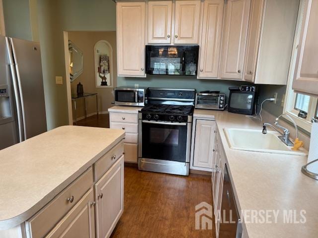 102 Leeds Ln, Monroe, NJ 08831 - kitchen with appliances with stainless steel finishes, light countertops, and dark wood-style flooring