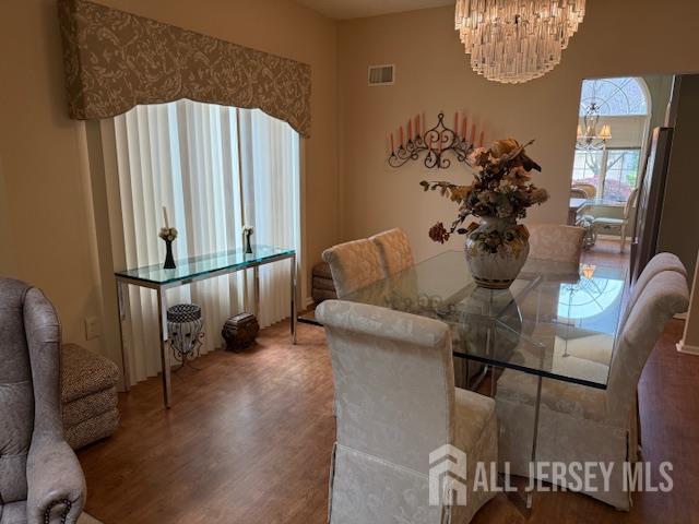 102 Leeds Ln, Monroe, NJ 08831 - dining space featuring a chandelier and wood finished floors
