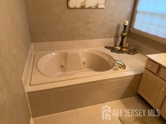 102 Leeds Ln, Monroe, NJ 08831 - full bathroom with a tub with jets and vanity