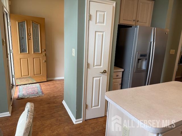 102 Leeds Ln, Monroe, NJ 08831 - kitchen featuring stainless steel fridge, light countertops, and wood finished floors