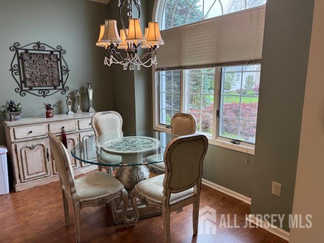 102 Leeds Ln, Monroe, NJ 08831 - dining space with healthy amount of natural light, wood finished floors, and a chandelier