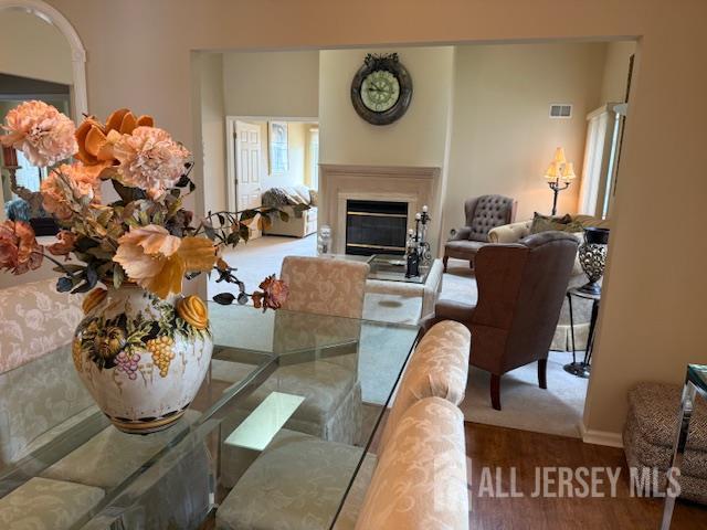 102 Leeds Ln, Monroe, NJ 08831 - dining space featuring wood finished floors and a glass covered fireplace