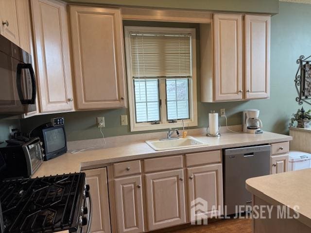 102 Leeds Ln, Monroe, NJ 08831 - kitchen featuring stainless steel dishwasher, black microwave, light countertops, and gas range