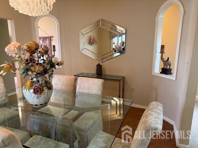 102 Leeds Ln, Monroe, NJ 08831 - dining space featuring arched walkways, wood finished floors, and plenty of natural light