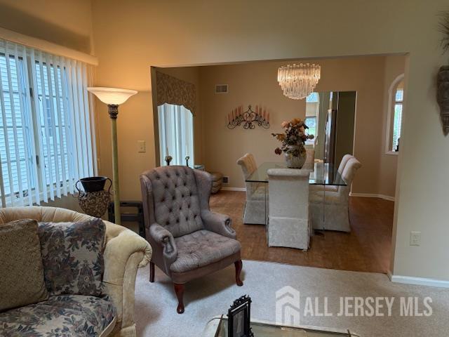 102 Leeds Ln, Monroe, NJ 08831 - living area with baseboards and a chandelier