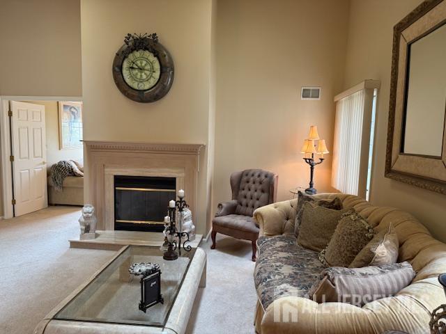 102 Leeds Ln, Monroe, NJ 08831 - living area with light colored carpet and a glass covered fireplace