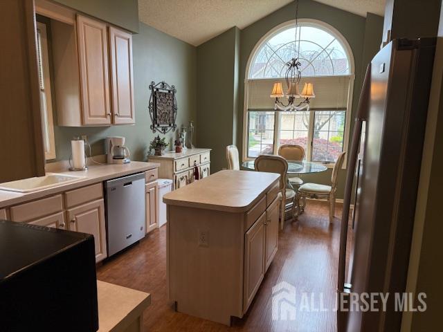 102 Leeds Ln, Monroe, NJ 08831 - kitchen featuring stainless steel appliances, vaulted ceiling, a chandelier, a center island, and light countertops