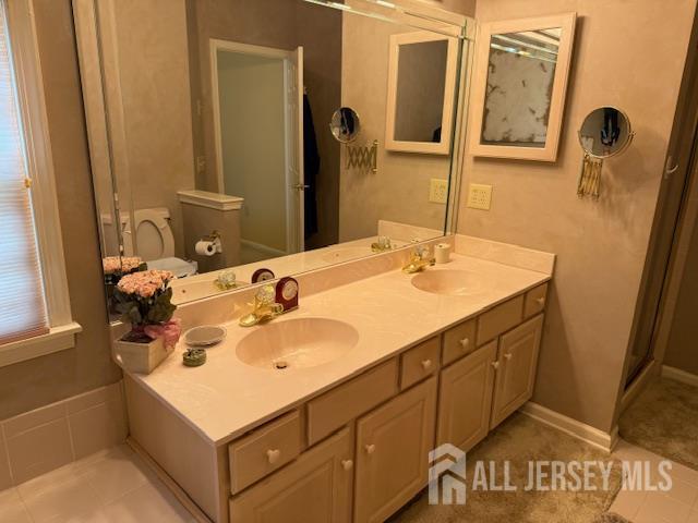 102 Leeds Ln, Monroe, NJ 08831 - bathroom featuring double vanity and a shower with door
