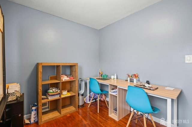 office with dark hardwood / wood-style flooring