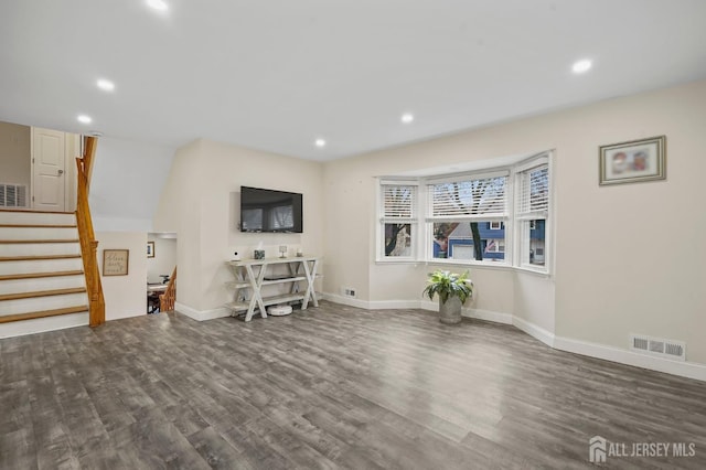 living room featuring dark wood-type flooring