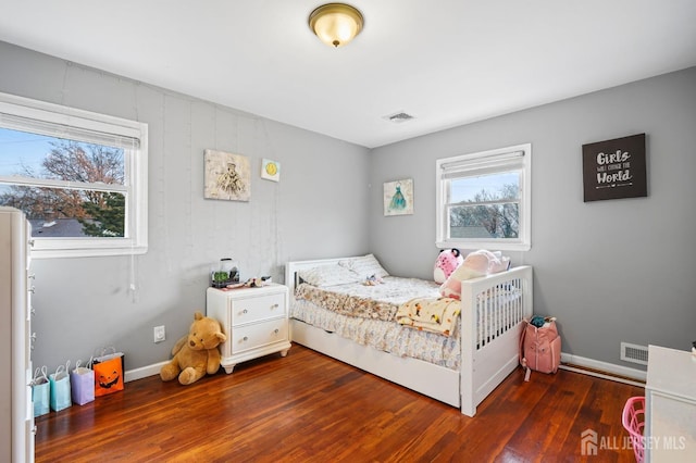 bedroom featuring dark hardwood / wood-style flooring