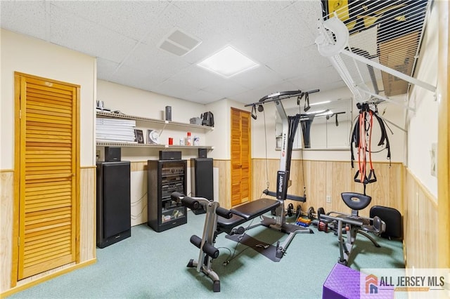 21 Tanglewood Pl, Monroe, NJ 08831 - exercise room featuring a wainscoted wall, carpet floors, wooden walls, and a paneled ceiling