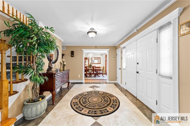 21 Tanglewood Pl, Monroe, NJ 08831 - entryway with inlaid floor details, crown molding, a chandelier, plenty of natural light, and a baseboard radiator