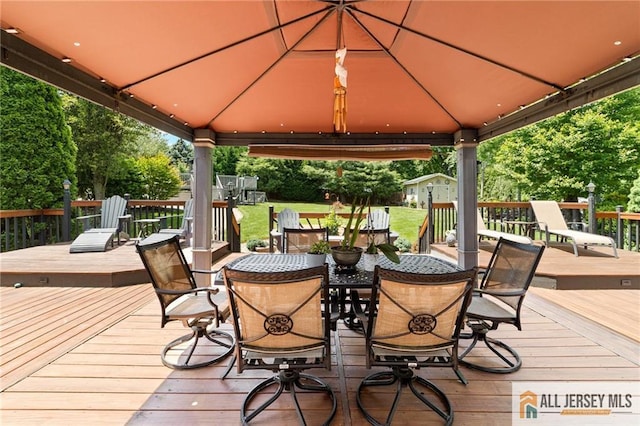 21 Tanglewood Pl, Monroe, NJ 08831 - deck featuring a gazebo, outdoor dining area, and a lawn