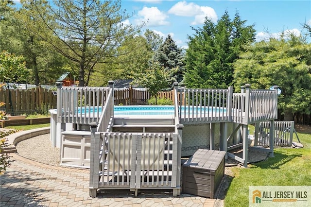 21 Tanglewood Pl, Monroe, NJ 08831 - view of pool featuring a wooden deck and view of wooded area