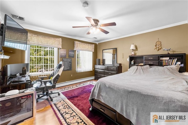 21 Tanglewood Pl, Monroe, NJ 08831 - bedroom with baseboard heating, crown molding, wood finished floors, an office area, and a ceiling fan