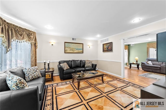 21 Tanglewood Pl, Monroe, NJ 08831 - living room with ornamental molding, recessed lighting, wood finished floors, and a baseboard radiator