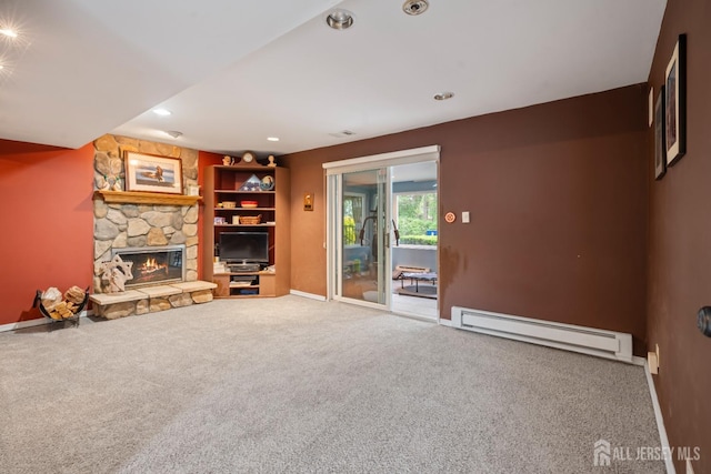 unfurnished living room featuring a baseboard heating unit, a stone fireplace, baseboards, and carpet floors