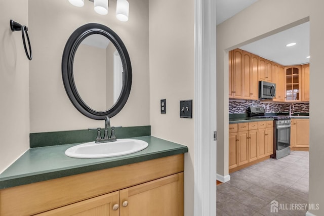 19 Albury Way N, Brunswick, NJ 08902 - bathroom featuring decorative backsplash, vanity, tile patterned floors, and recessed lighting