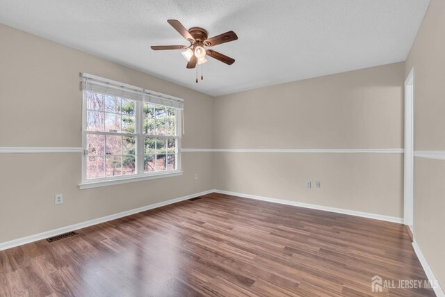 19 Albury Way N, Brunswick, NJ 08902 - spare room with ceiling fan, wood finished floors, and baseboards