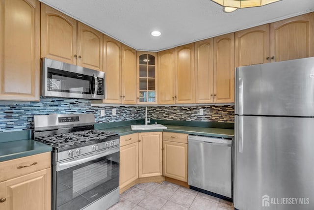 19 Albury Way N, Brunswick, NJ 08902 - kitchen with appliances with stainless steel finishes, light brown cabinetry, light tile patterned floors, recessed lighting, and a textured ceiling