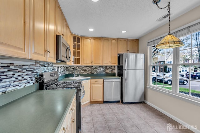 19 Albury Way N, Brunswick, NJ 08902 - kitchen with stainless steel appliances, a sink, decorative backsplash, a textured ceiling, and dark countertops