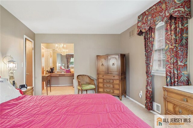 1 Eileen Ct, East Brunswick, NJ 08816 - bedroom with a chandelier, light colored carpet, and ensuite bath