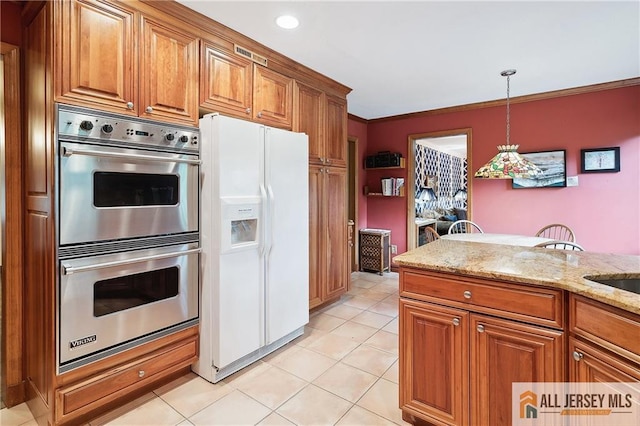 1 Eileen Ct, East Brunswick, NJ 08816 - kitchen with white fridge with ice dispenser, double oven, brown cabinetry, light stone countertops, and hanging light fixtures