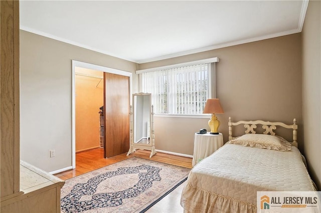 1 Eileen Ct, East Brunswick, NJ 08816 - bedroom with ornamental molding, a closet, and wood finished floors