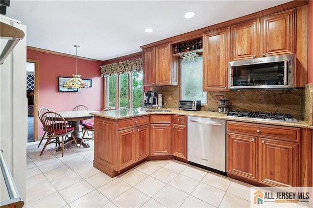 1 Eileen Ct, East Brunswick, NJ 08816 - kitchen with appliances with stainless steel finishes, brown cabinets, light stone counters, tasteful backsplash, and recessed lighting