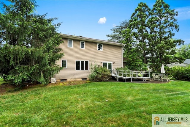 1 Eileen Ct, East Brunswick, NJ 08816 - back of house featuring a lawn