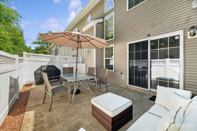 44 Windsong Cir E, Brunswick, NJ 08816 - view of patio / terrace with a grill, outdoor dining area, and an outdoor hangout area