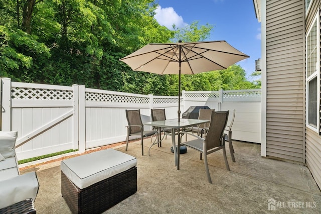 44 Windsong Cir E, Brunswick, NJ 08816 - fenced backyard with a patio area and outdoor dining space
