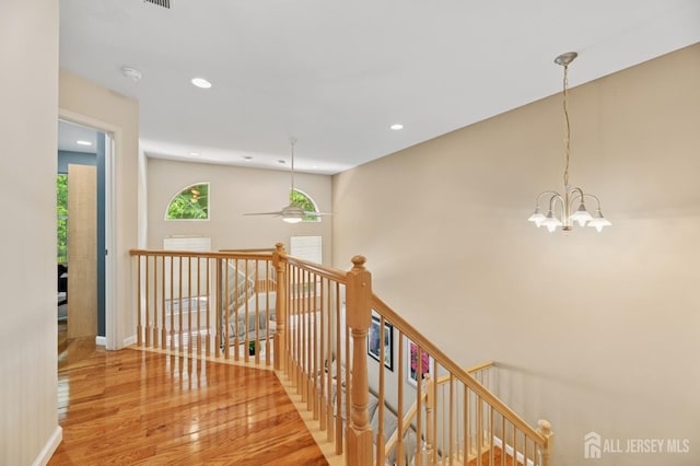 44 Windsong Cir E, Brunswick, NJ 08816 - corridor featuring an upstairs landing, wood finished floors, recessed lighting, and a chandelier