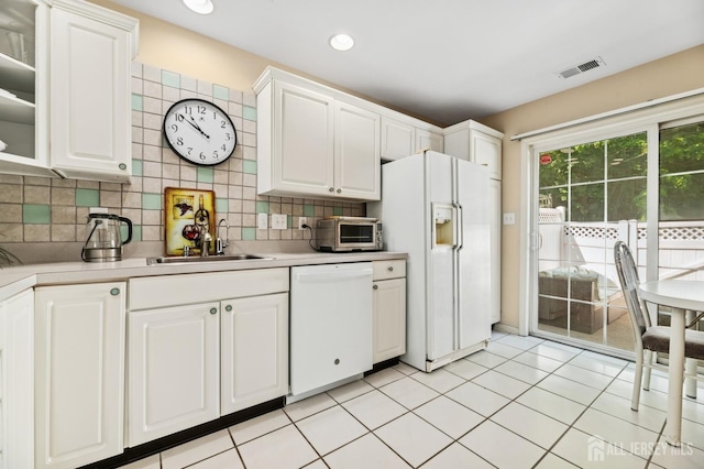 44 Windsong Cir E, Brunswick, NJ 08816 - kitchen featuring white appliances, light countertops, white cabinets, tasteful backsplash, and recessed lighting