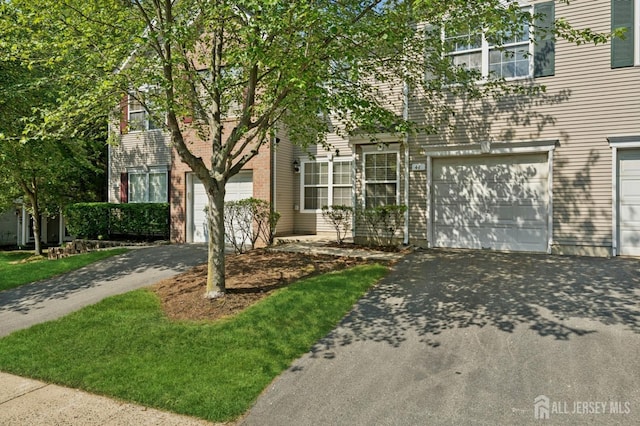 44 Windsong Cir E, Brunswick, NJ 08816 - view of front of home with driveway and an attached garage