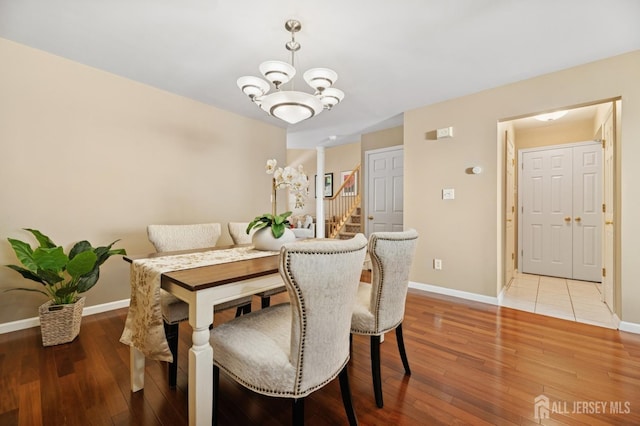 44 Windsong Cir E, Brunswick, NJ 08816 - dining room featuring a chandelier, stairway, and light wood-style floors