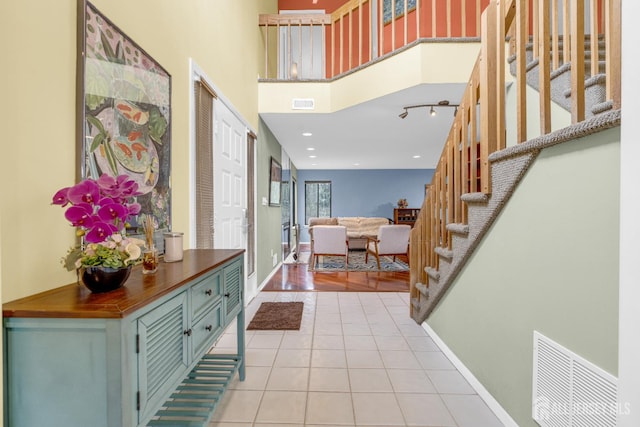 47 Park Gate Dr, Edison, NJ 08820 - foyer with light tile patterned floors and stairway