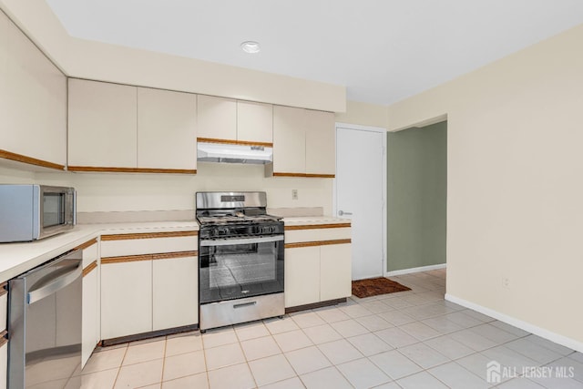 47 Park Gate Dr, Edison, NJ 08820 - kitchen with appliances with stainless steel finishes, exhaust hood, and light countertops