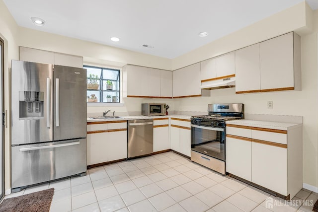 47 Park Gate Dr, Edison, NJ 08820 - kitchen featuring appliances with stainless steel finishes, light countertops, under cabinet range hood, and recessed lighting