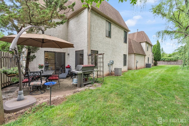 47 Park Gate Dr, Edison, NJ 08820 - rear view of house with roof with shingles, stucco siding, a fenced backyard, and a patio